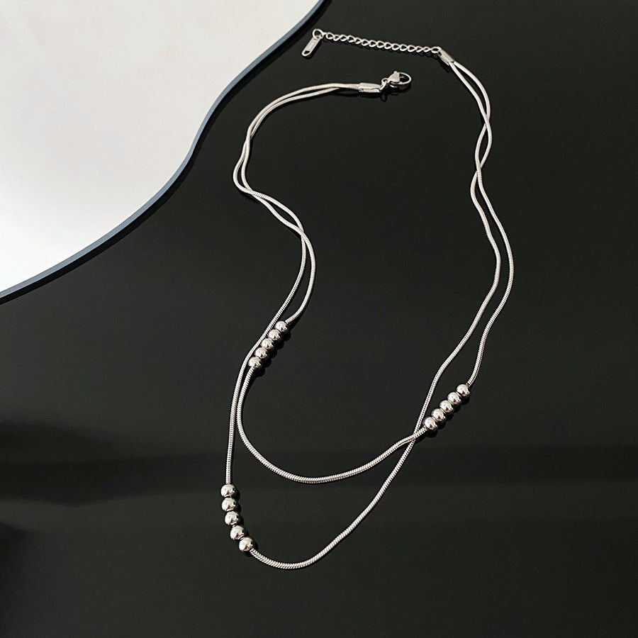 Titanium double layered necklace, anodized gold, raw titanium in silver color