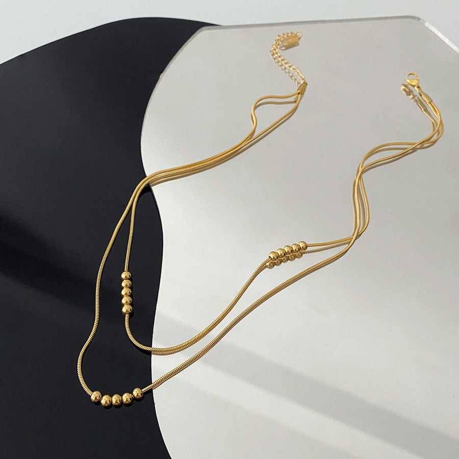 Titanium double layered necklace, anodized gold, raw titanium in silver color